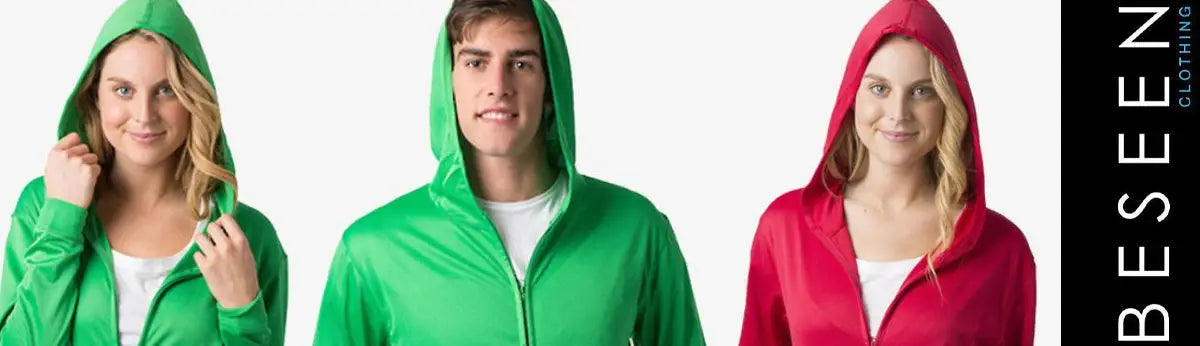 Three models in green and red hooded sweatshirts from Be Seen Clothing for mens and ladies