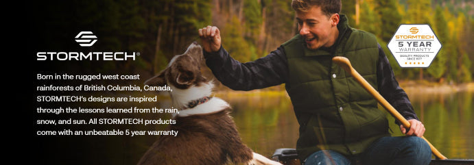 Man in vest petting dog in canoe wearing Stormtech jackets for outdoors adventures