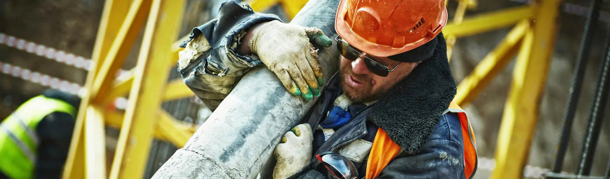 Construction worker with pipe wearing outdoor sun hats from PPE Sun Hats collection