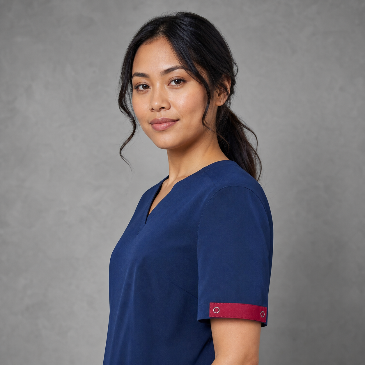 CID940U Avery Unisex Scrub Identifier in Cherry on a navy healthcare scrub top