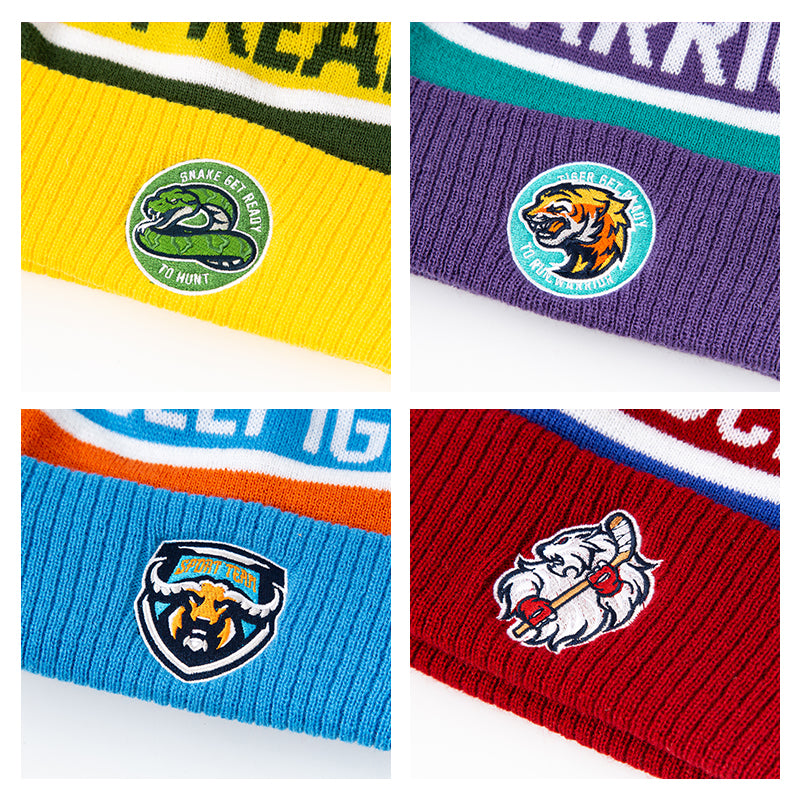 Vibrant knitted pompom beanie hats with embroidered animal logos in bold colors perfect for workwear and uniforms