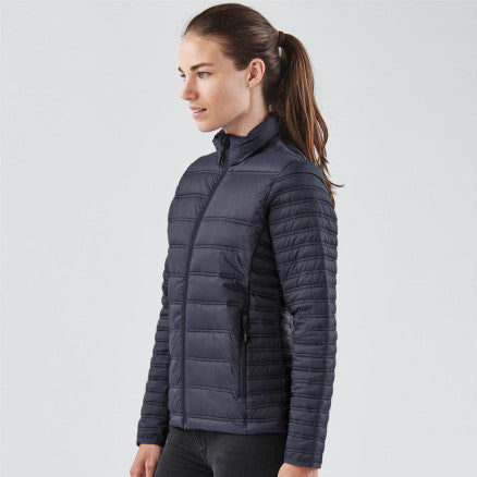 Navy blue quilted puffer ladies basecamp thermal jacket with high collar and zippered pockets ideal for workwear and uniforms