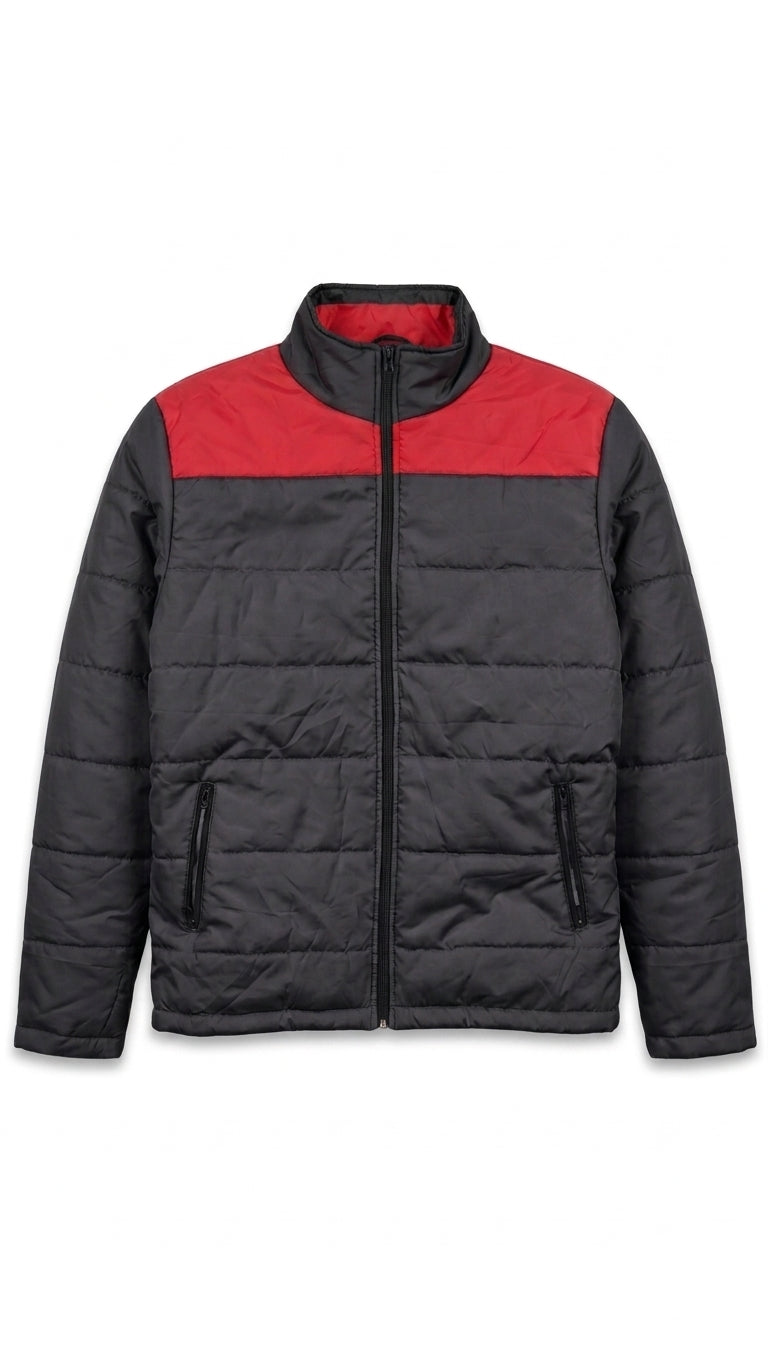 A colorblock puffer jacket with a black body and a red yoke across the chest, featuring a stand-up collar and front zipper closure.