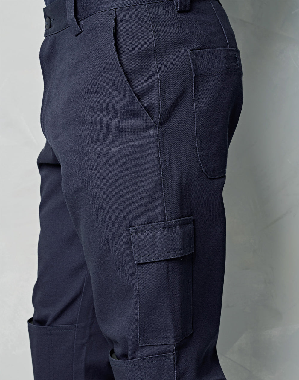 Dark navy heavy drill cargo pants with knee pads multiple pockets and reinforced stitching ideal for workwear uniforms