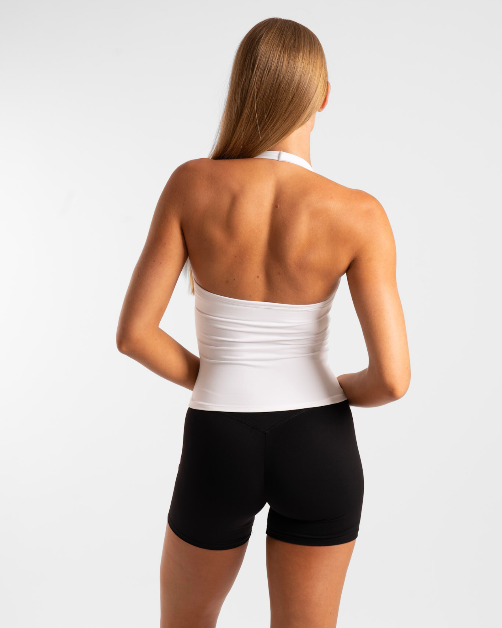 White arctic sculpt halter tank with ribbed waistband perfect for stylish workwear and uniforms