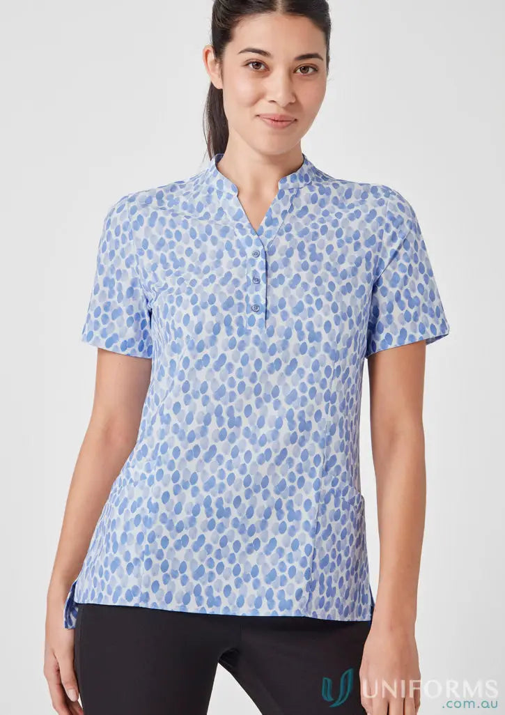Woman wearing Bizcare Women’s Florence Stardust Print Tunic with patterned short sleeves