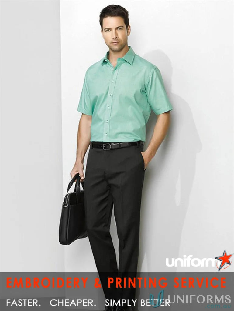 Man wearing cool stretch slimline pant in green shirt and black pants for mens cool stretch