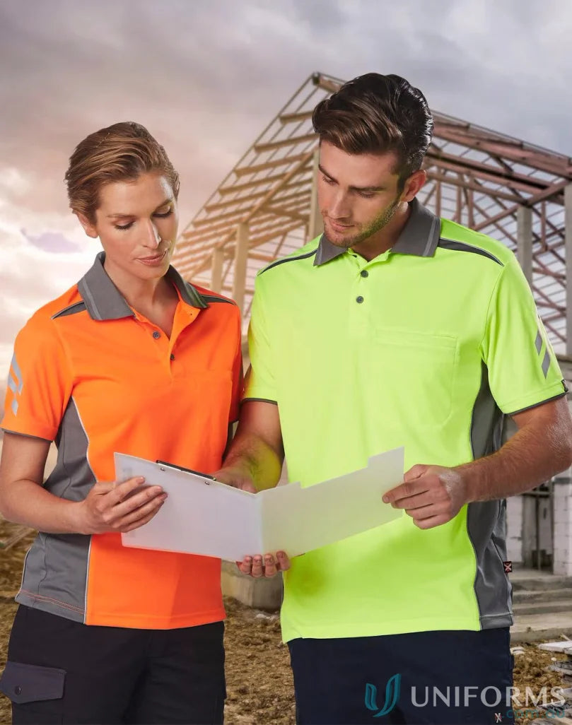 Two construction workers reviewing plans in their cooldry vented polo shirts staying cool on site