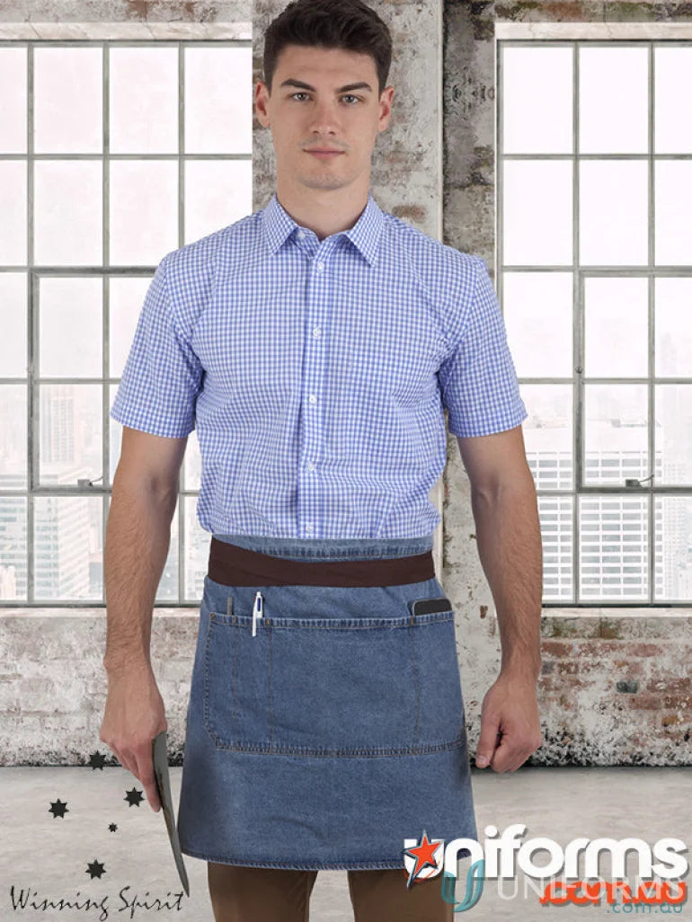 Man modeling East Village Half denim apron with short-sleeved blue gingham shirt ap08 m3001