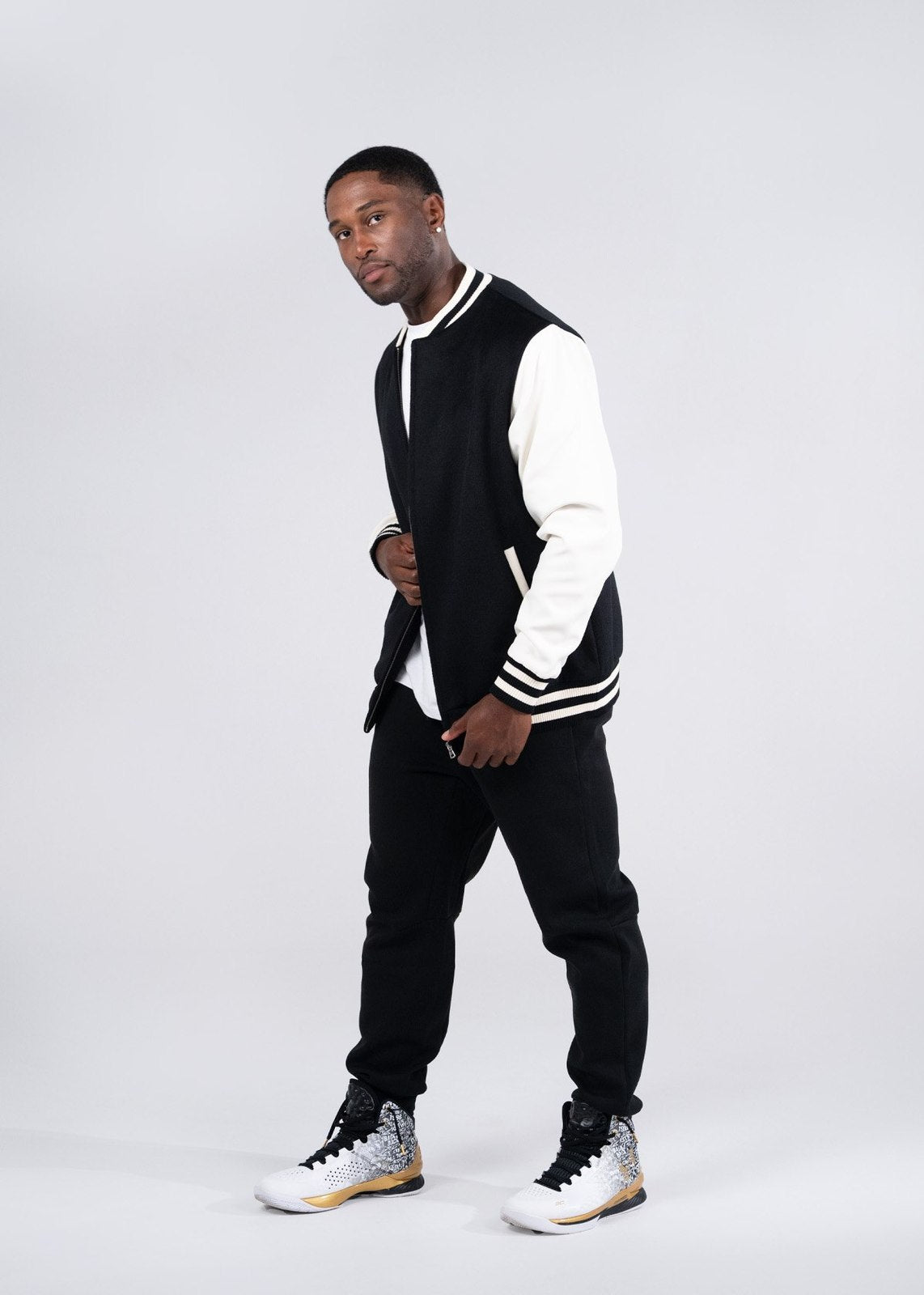 Black and white varsity wool blend jacket with ribbed cuffs and collar perfect for stylish workwear or uniforms