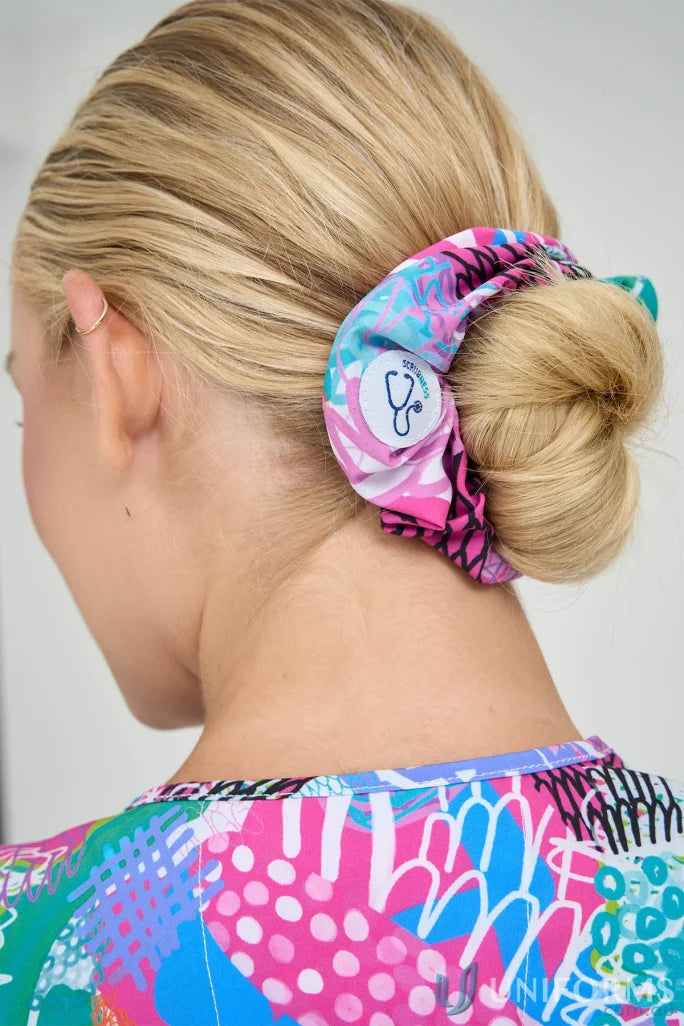 Colorful patterned hair scrunchie with stethoscope logo for Gliding Bunjil ladies fit uniforms