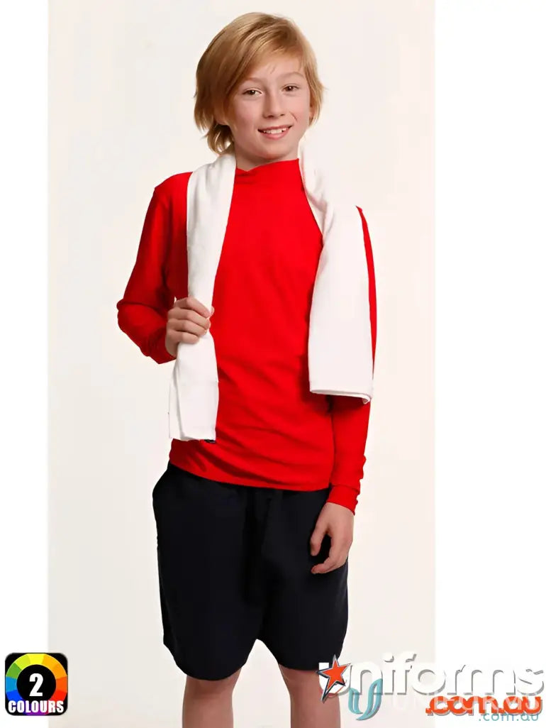 Boy in red long-sleeve shirt and black shorts with a terry towelling gym towel