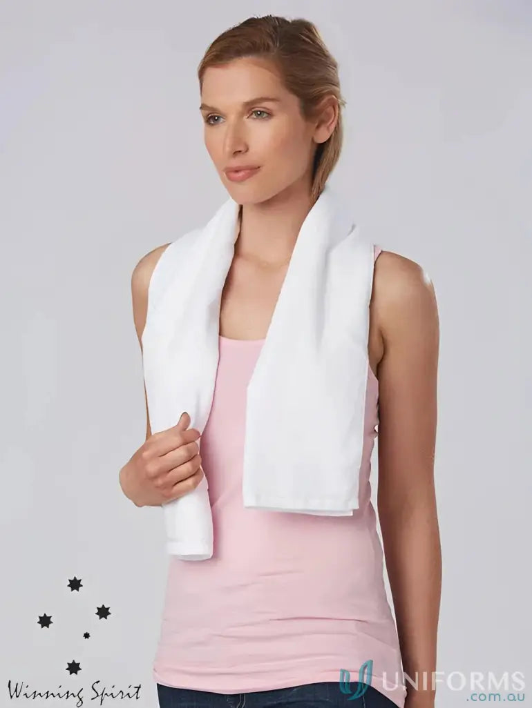 White towel draped around woman’s neck, perfect terry towelling gym fitness towel