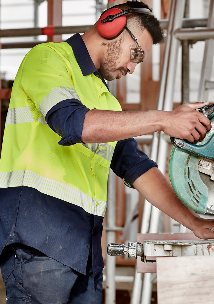 Man in HiVis Segmented Tape LS Shirt with yellow workwear, red ear protection