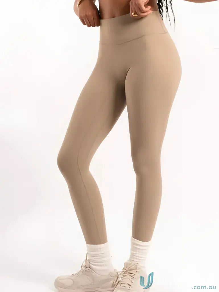 Beige invicible scrunch latte leggings with smooth high-waisted fabric perfect for comfortable work uniforms and workwear