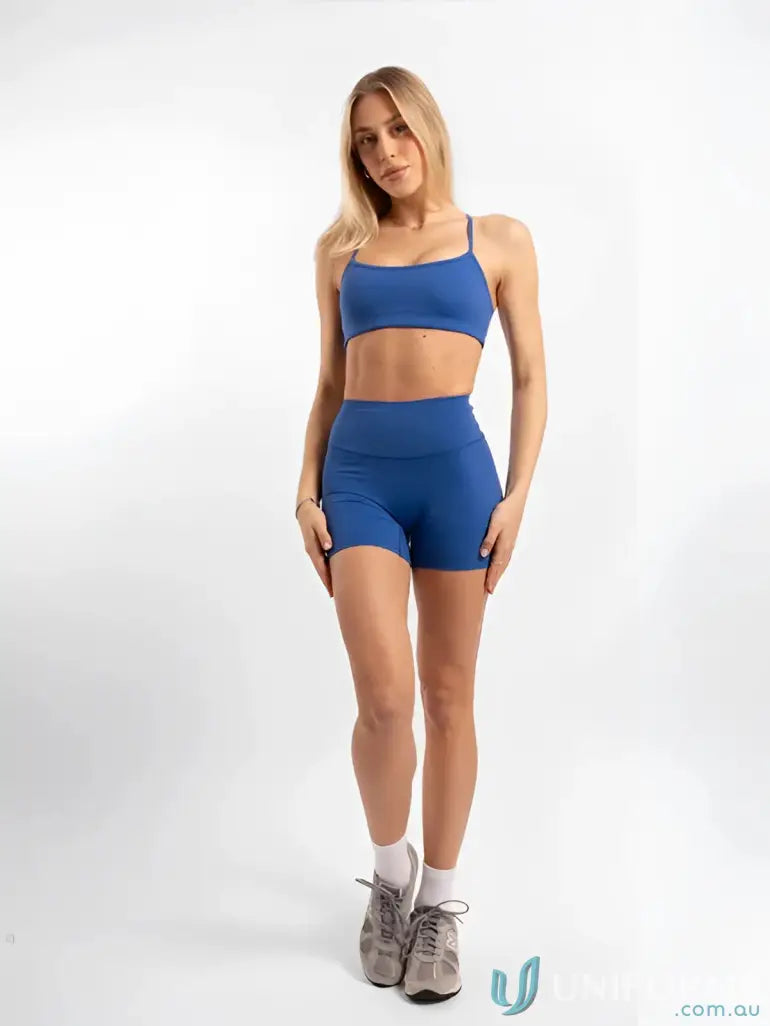 Blue invisible scrunch riviera shorts two-piece uniform set with stretchy crop top and high-waisted workwear shorts
