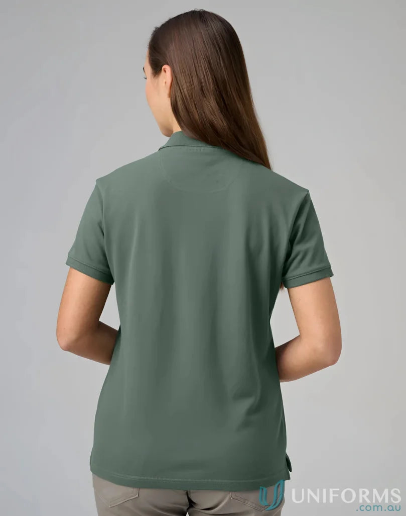 Womans green polo shirt from PS56 Darling Harbour with a winning spirit ladies vibe