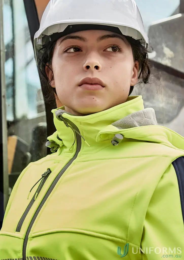 Construction worker in neon jacket and hard hat wearing Ladies Streetworx 2 in 1 Stretch Softshell Jacket