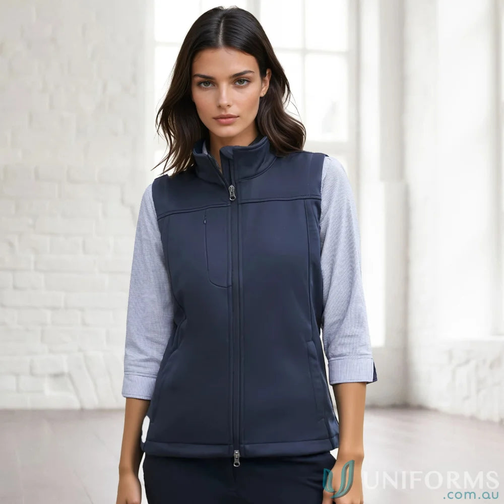 A womans navy blue sleeveless vest with a full zipper closure and a stand-up collar.