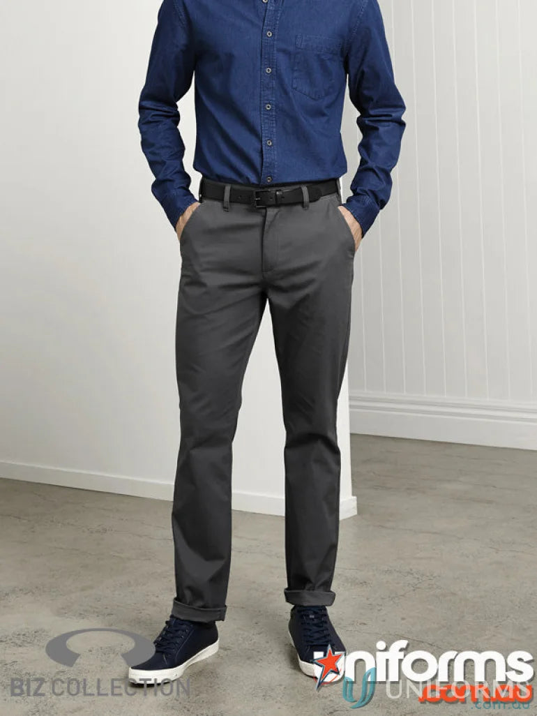 Man in blue shirt and gray Lawson Stretch Chino Pants from Biz Collection Mens