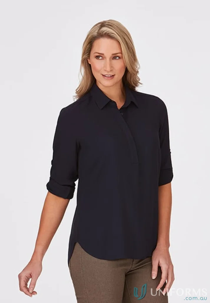 Woman in navy Meghan Top, perfect for action fit medical uniforms or casual wear