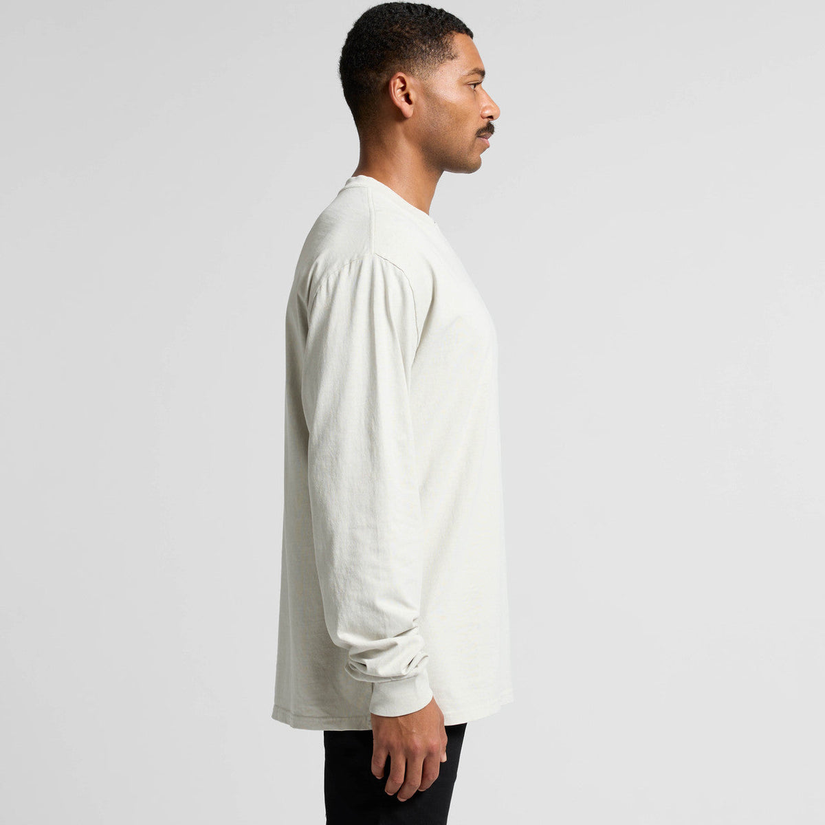 Cream-colored long-sleeved shirt with a relaxed fit and puff sleeves.