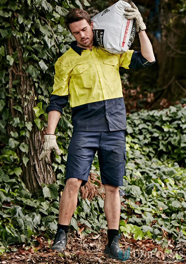 Man carrying soil in syzmik mens rugged cooling vented shorts zs505 vented