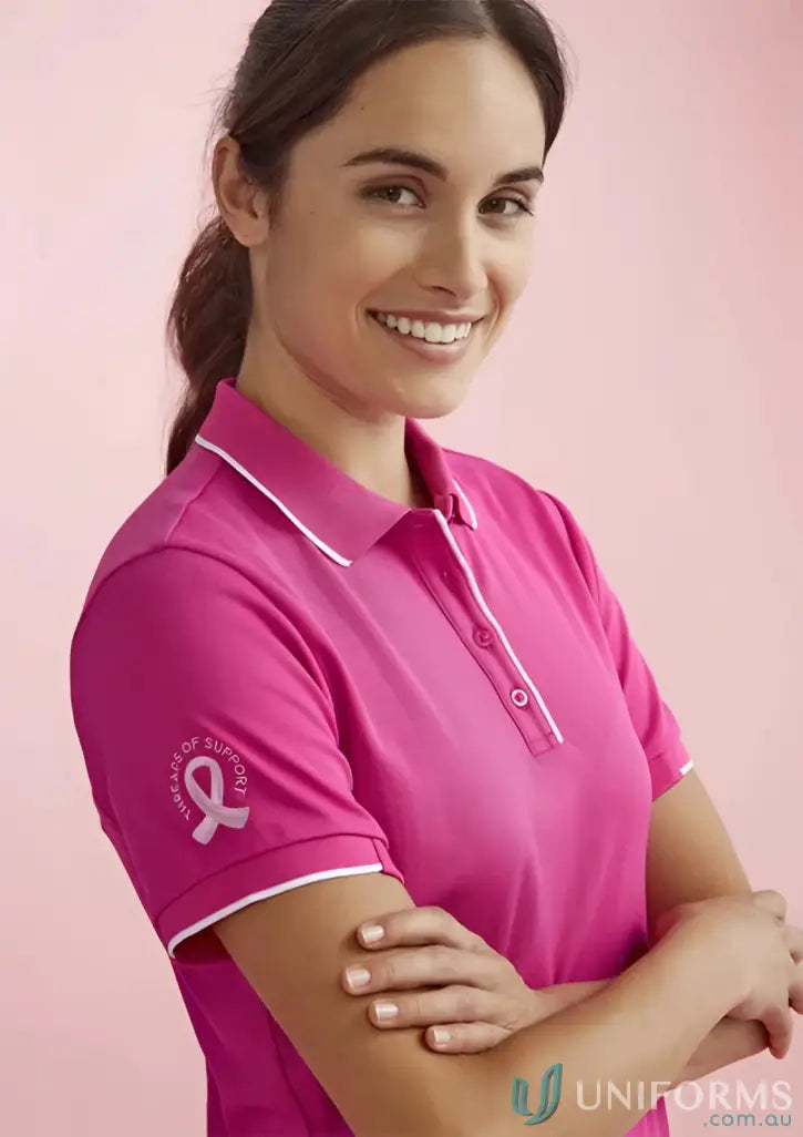 NBCF Ladies Pink Polo shirt with white trim, perfect for bizcare women’s pink style