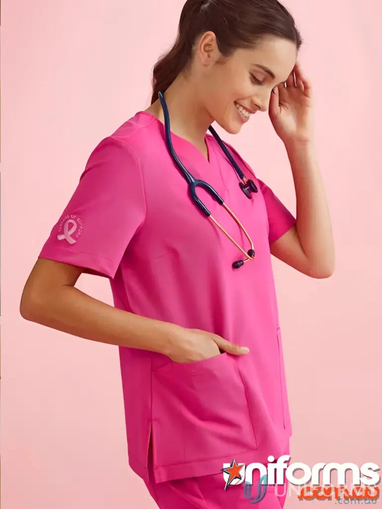 Pink V-Neck Scrub Top from Bizcare Women’s Pink collection with stethoscope for confident work