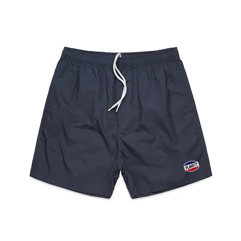 Dark navy blue nemesis beach shorts with white drawstring and logo patch perfect for casual work uniforms or beachwear