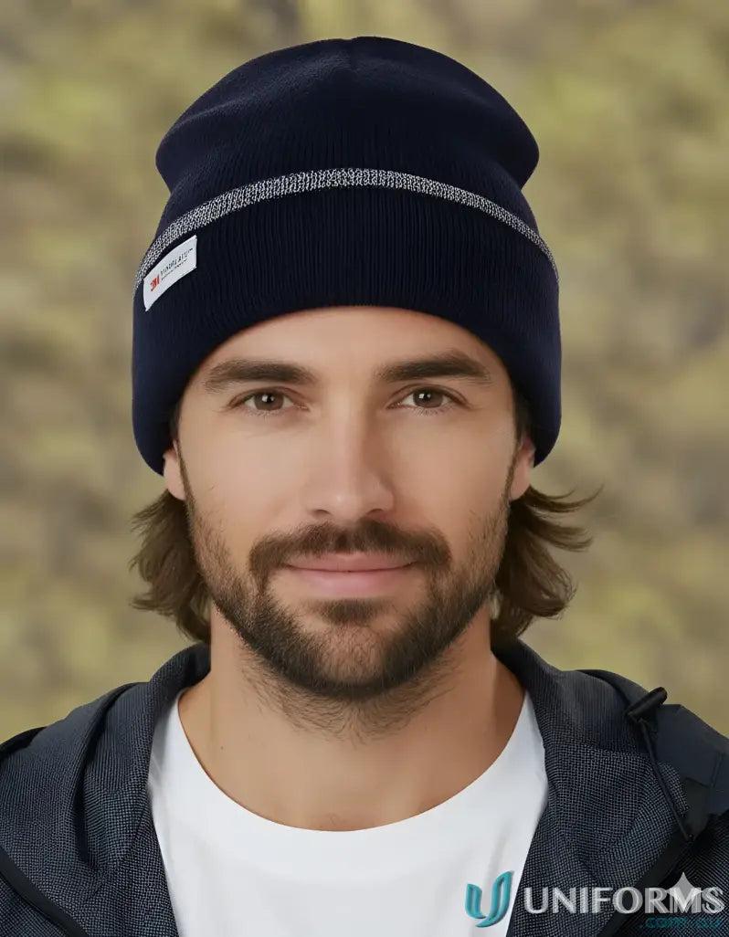 Navy blue Thinsulated cuff beanie with reflective stripe and white tag for warmth