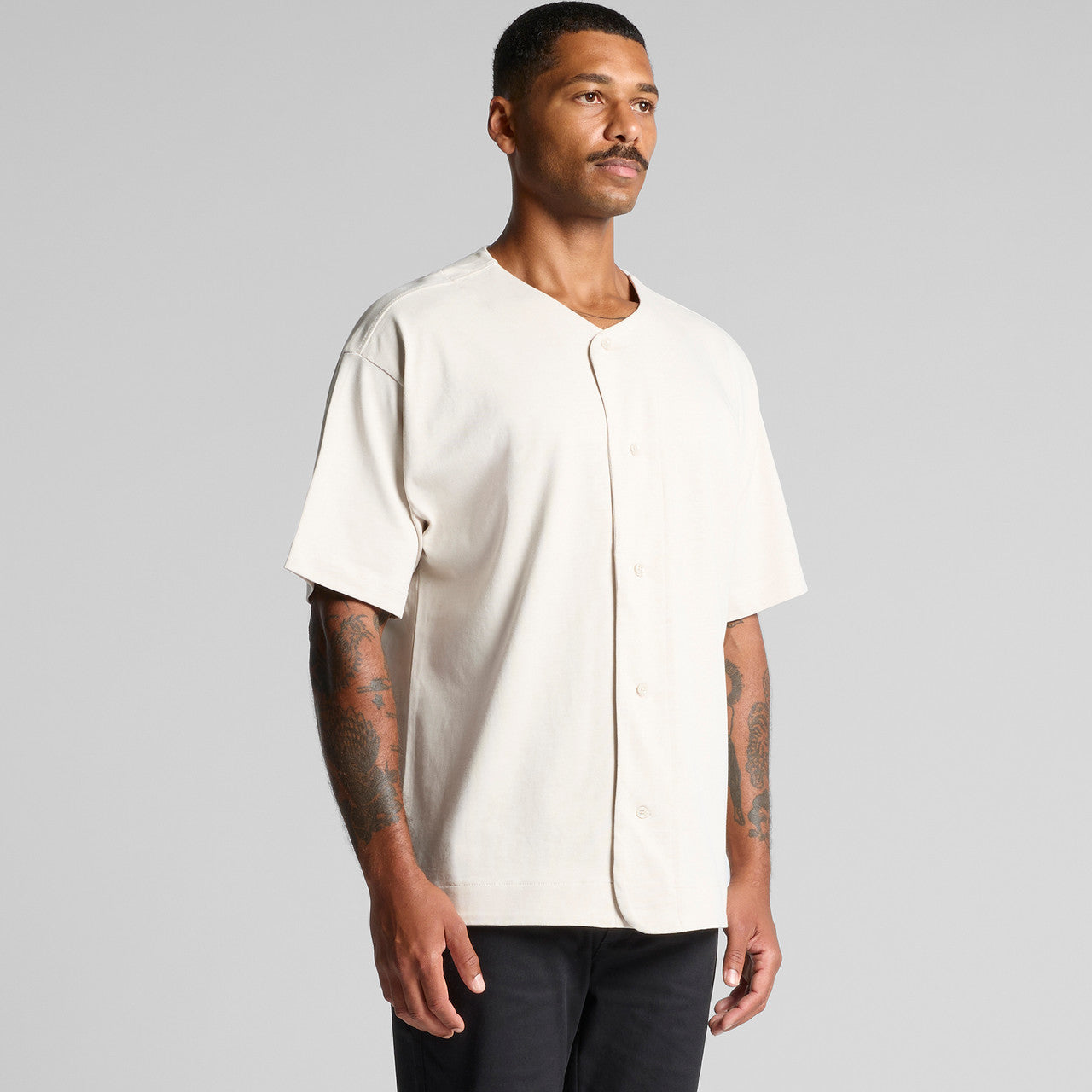 White baseball jersey with short sleeves and button-down front.