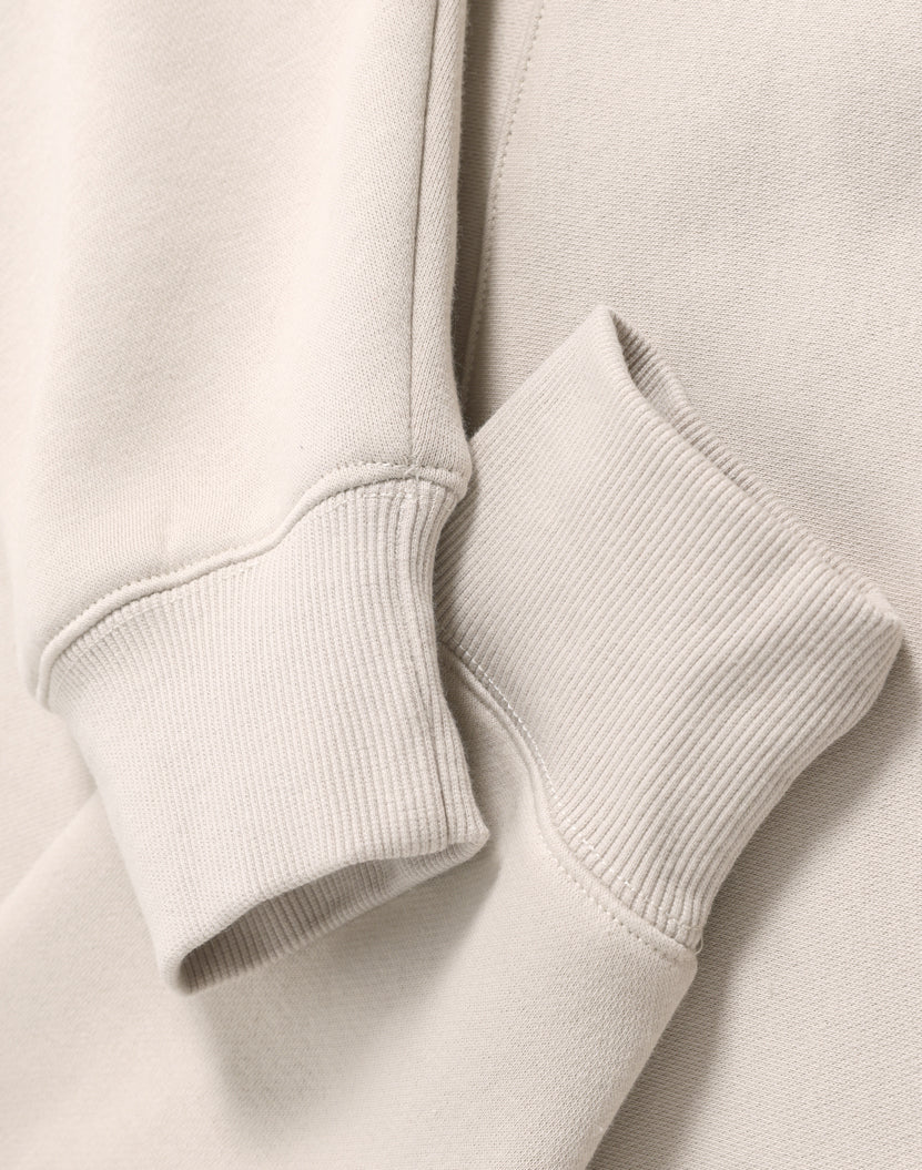 Cream-colored ribbed knit cuffs on a soft cotton premium oversized bone hoodie perfect for workwear uniforms