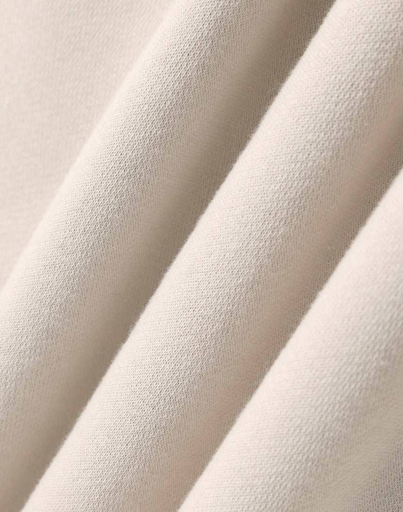 Premium oversized bone hoodie made of soft cream cotton fabric with subtle texture great for workwear uniforms