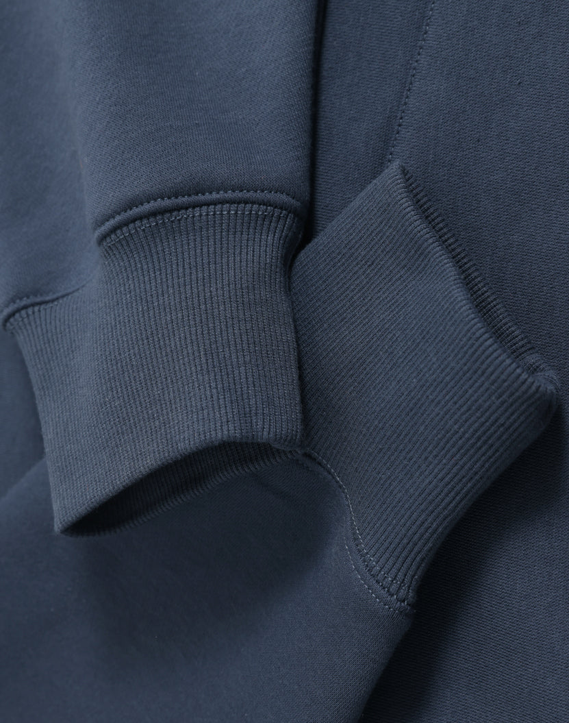 Dark blue ribbed knit cuffs on a soft cotton premium oversized slate hoodie perfect for workwear and uniforms
