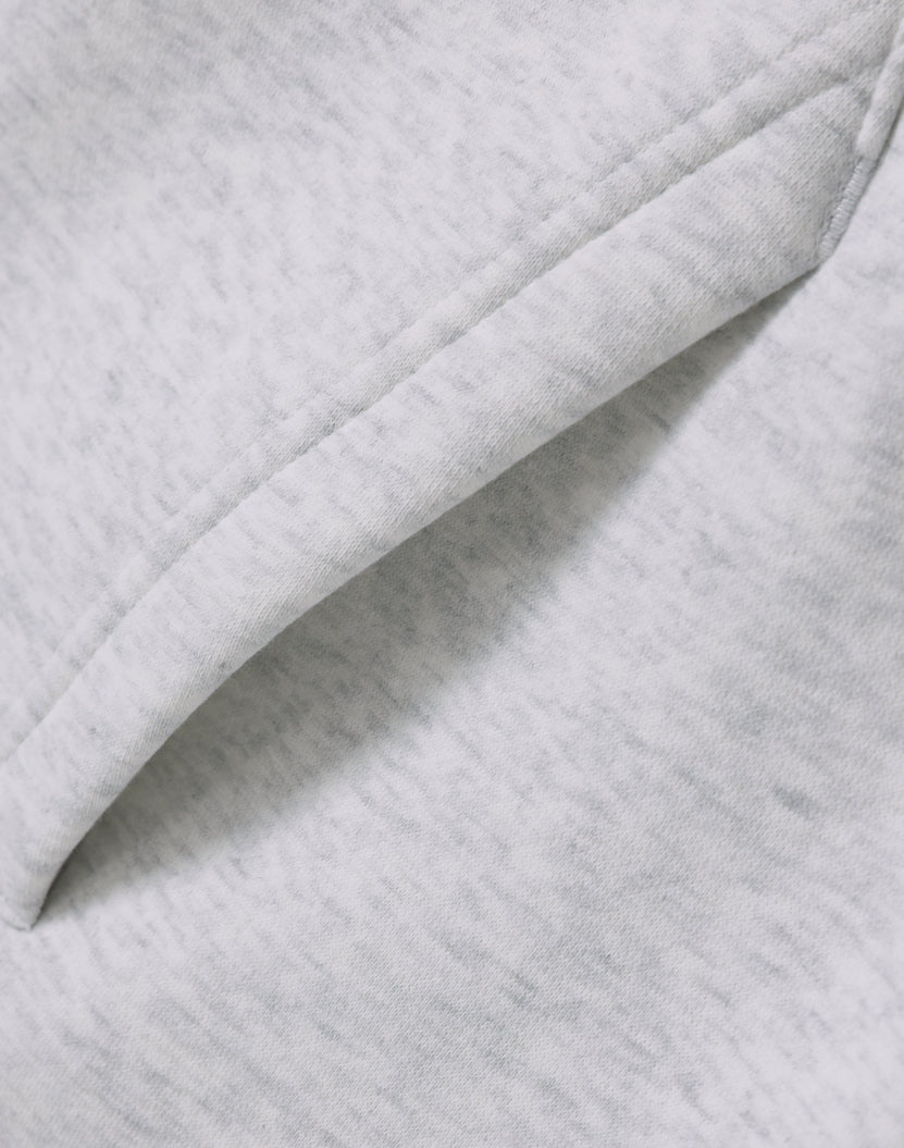 Light gray heathered fleece fabric with visible stitching on premium oversized white marle hoodie for workwear uniforms