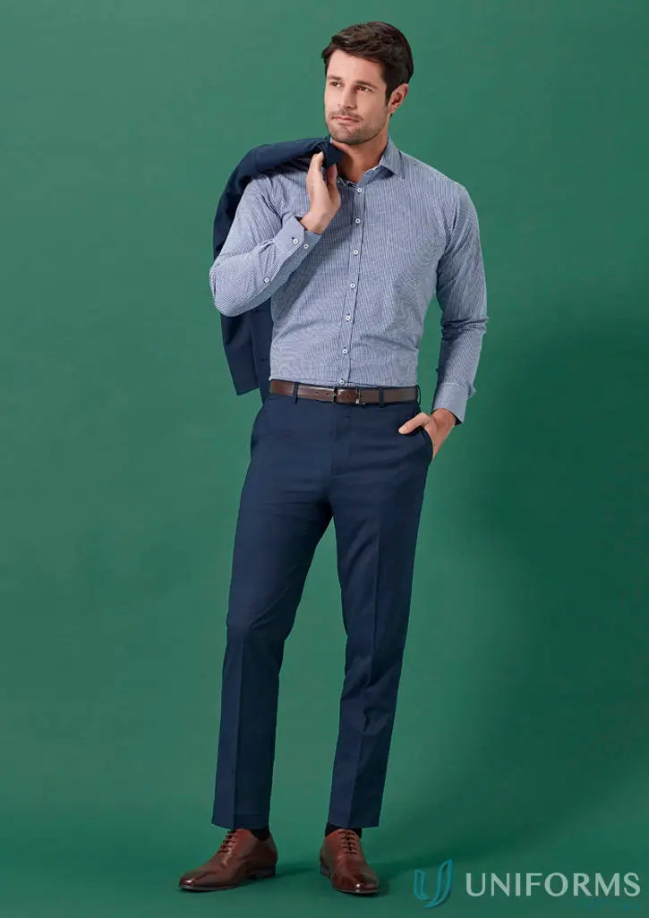 Man in a blue Renew Slim Fit Flat Front Pant made with recycled polyester for corporate settings