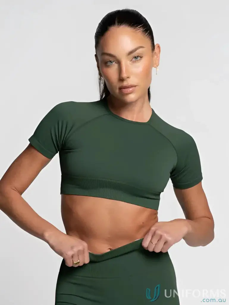 Dark green seamless cropped tee with ribbed hem and raglan sleeves perfect for stylish work uniforms or casual workwear
