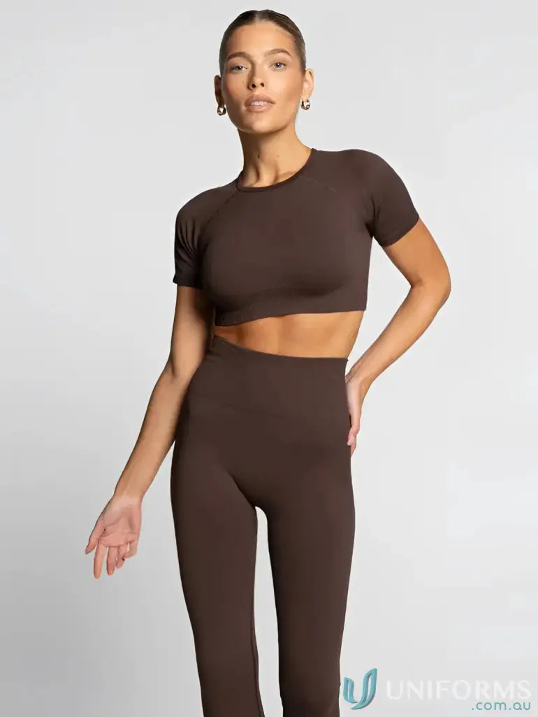 A sleek brown seamless cropped tee and leggings set ideal for comfortable workwear or casual workout uniforms