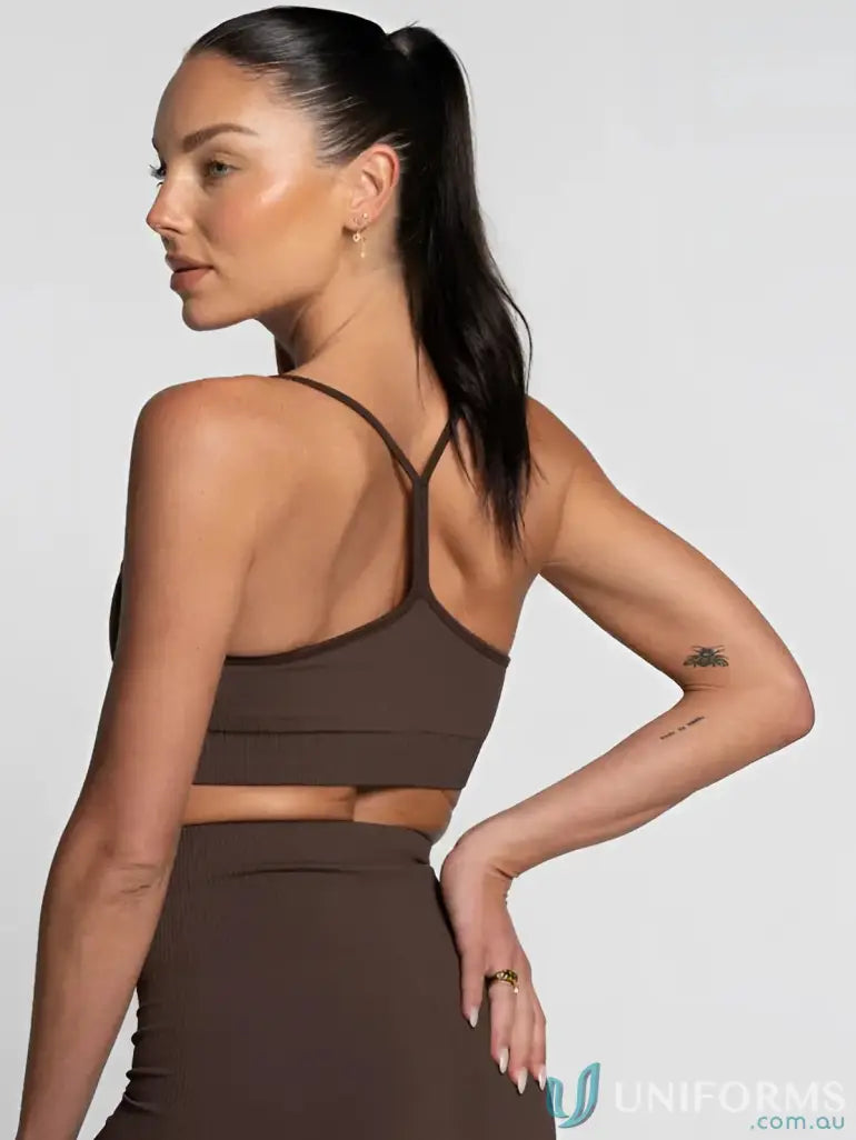 Brown seamless espresso active crop top with crisscross back straps made for workwear and athletic uniforms
