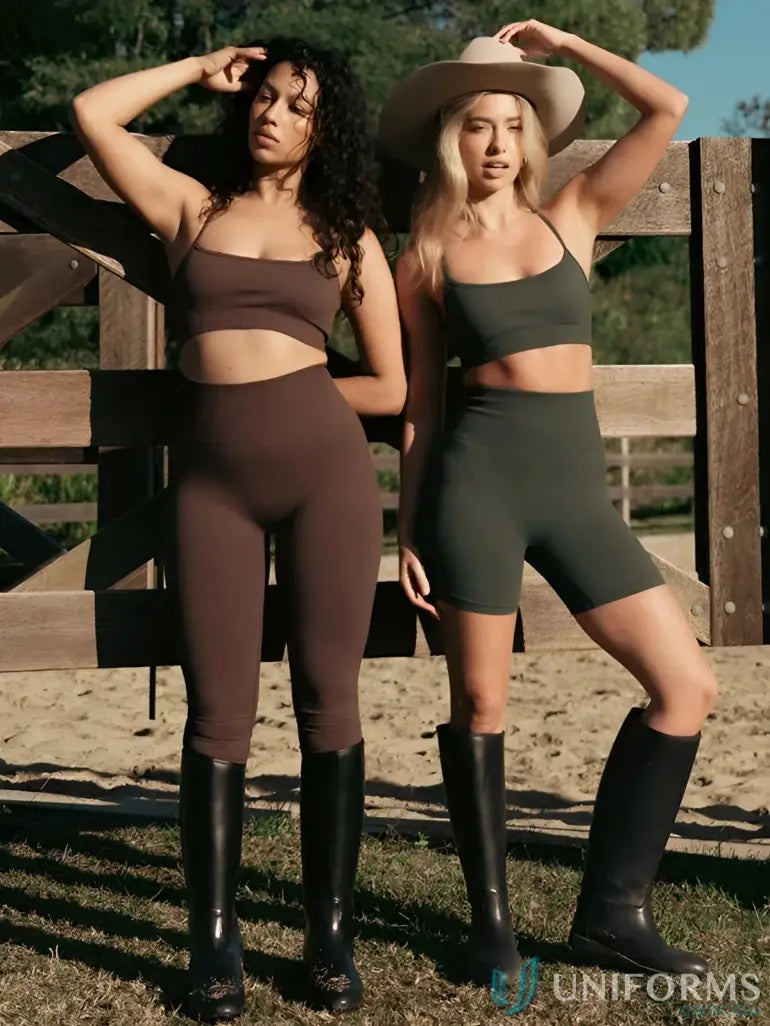 Two women wearing seamless invisible scrunch espresso leggings in brown and olive green workwear crop tops and boots