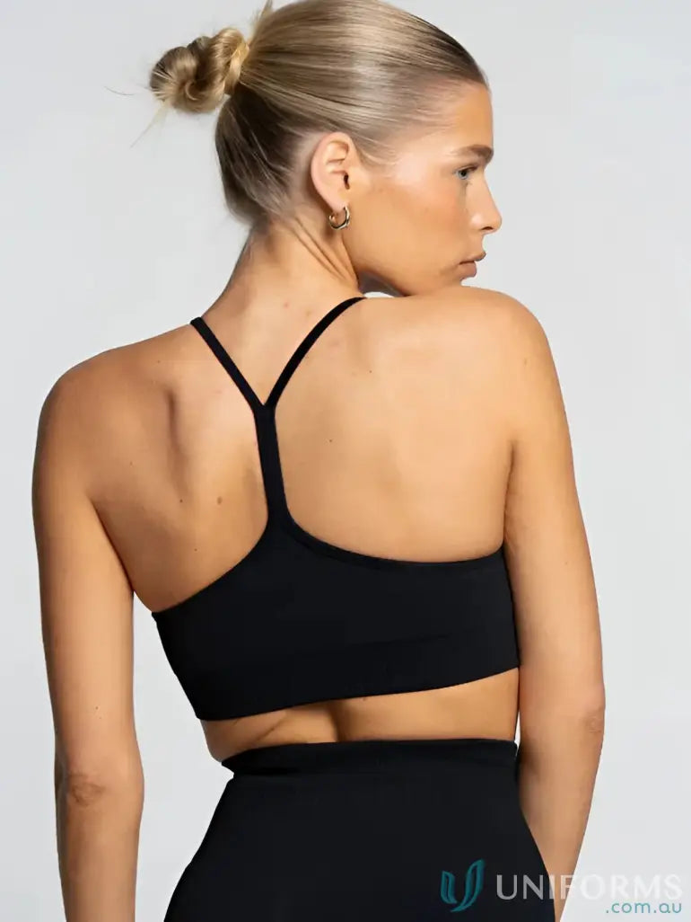 Seamless onyx active crop black sports bra with thin crisscross straps and seamless back perfect for workwear uniforms
