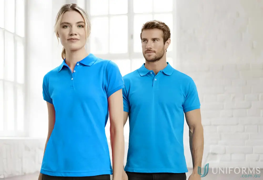 Two people wearing blue Sorrento Polo shirts from Biz Collection mens neon short sleeve polo line