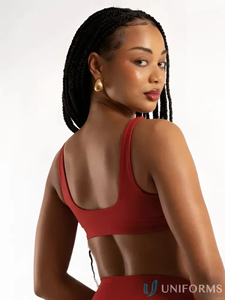 Red sports bra with thin straps and seamless design perfect for comfy uniforms or workwear basics