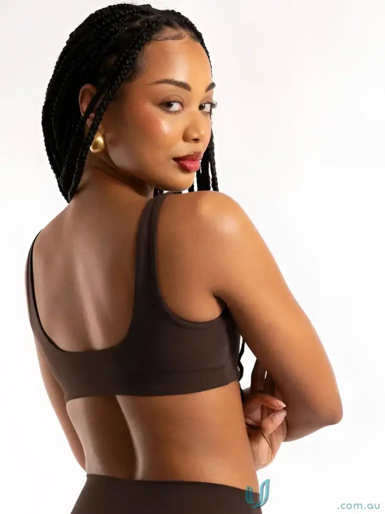 Black seamless sports bra with racerback design perfect for work uniforms or active workwear comfort and style