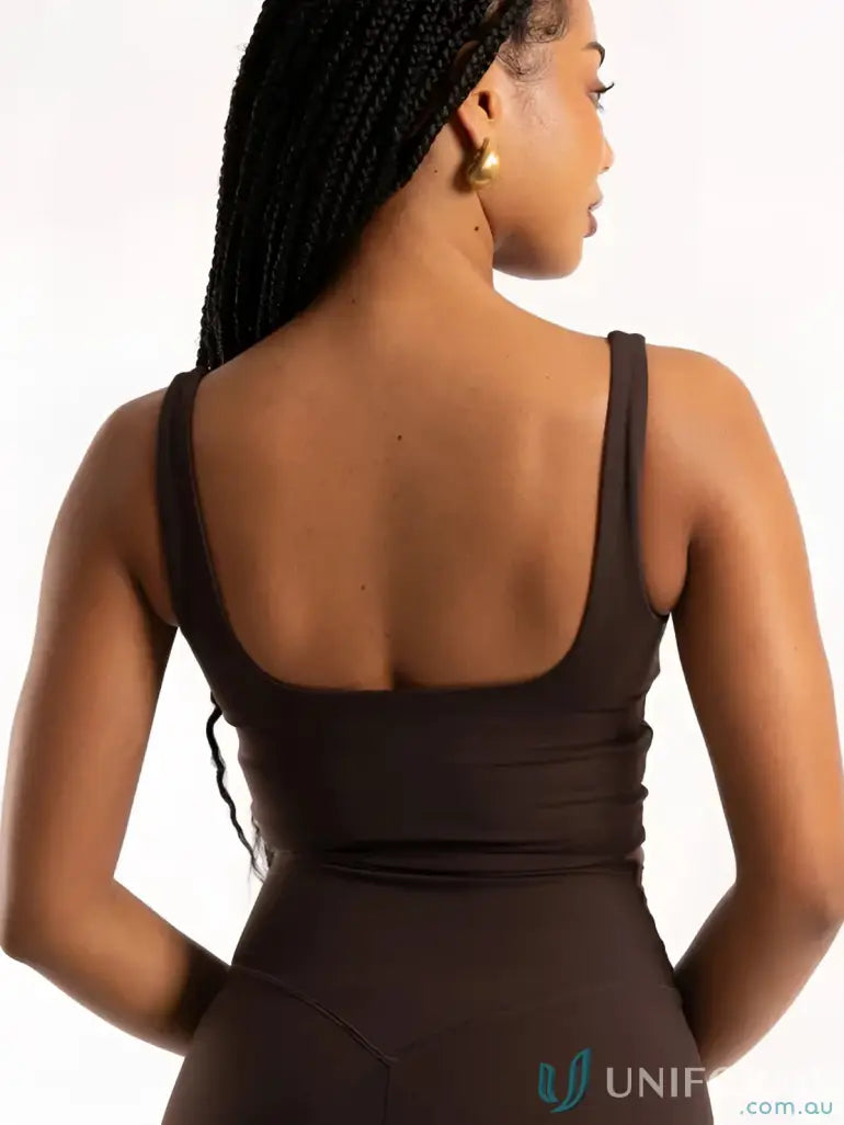 Black sleeveless bodysuit with square neckline and fitted silhouette perfect for stylish work uniforms and workwear