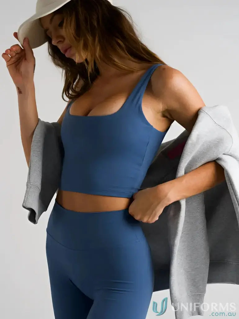 Blue athletic crop top with wide straps and square neckline perfect for comfortable work uniforms or casual workwear