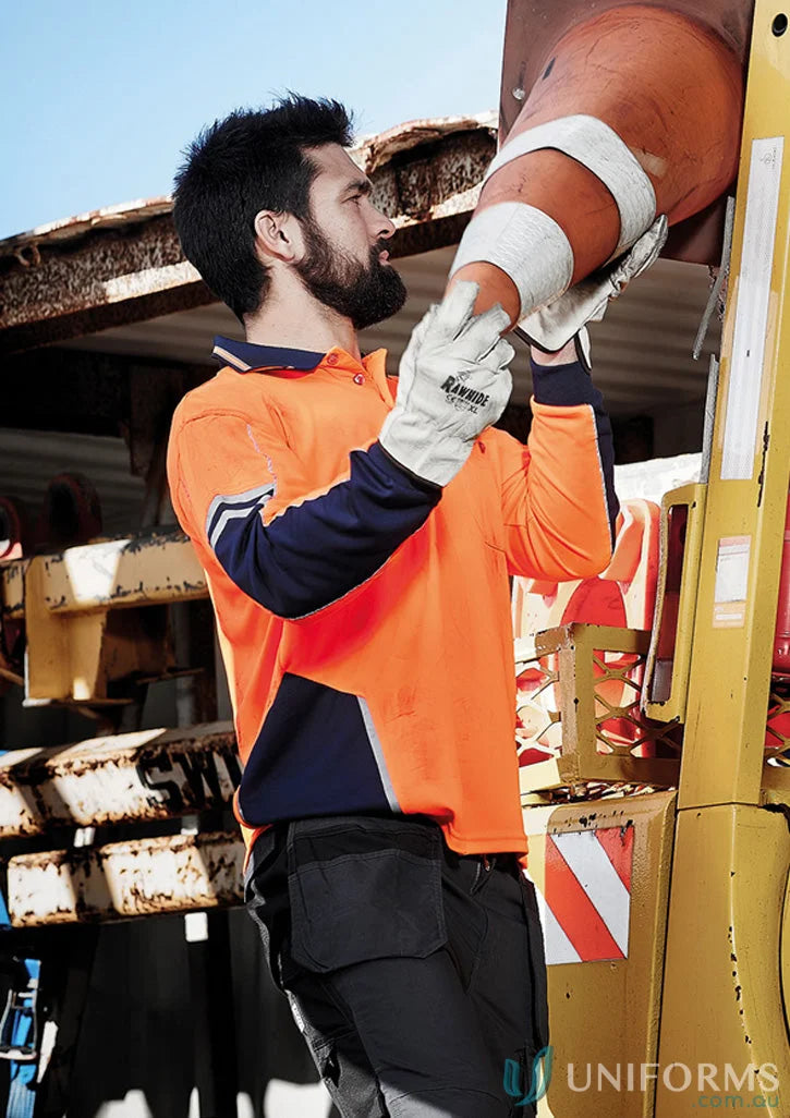 Construction worker in Syzmic Squad Safety LS Polo stay visible on site