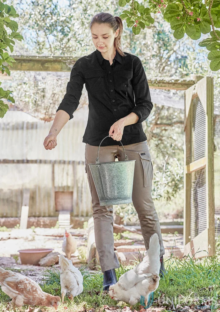 Green metal bucket with handle shown alongside 1Komma5 womens lightweight tradie shirt ideal for work uniforms and workwear