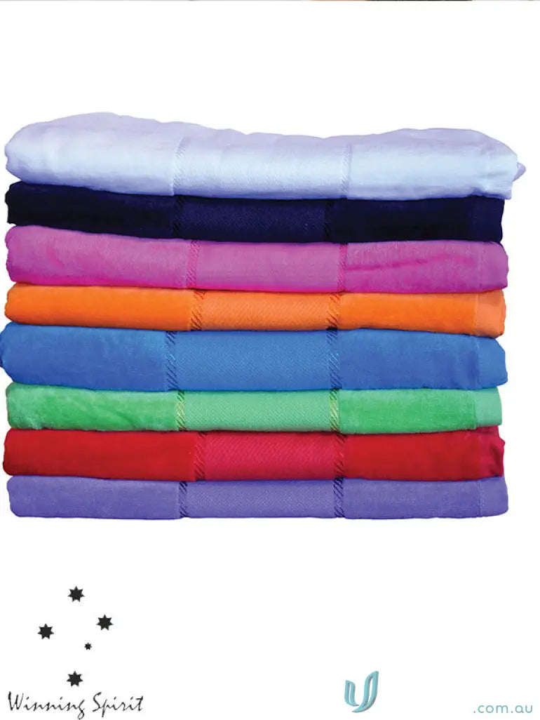 Colorful stack of terry velour beach blankets, perfect velour beach towel for summer